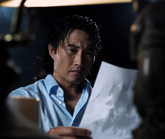 HIFF Trailer - still of Daniel Dae Kim looking at a paper with a magic ink blot taken from an animated and visual effects-heavy film festival trailer produced by Hyperspective